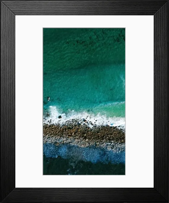 Framed Print : Image captured by a drone that shows the surprising contrast between the turquoise waters of the ocean Framed Print : Image captured by a drone that shows the surprising contrast between the turquoise waters of the ocean