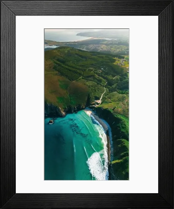 Framed Print : Captivating drone shot capturing a secluded beach surrounded by the rolling green hills of Galicia The coastline Framed Print : Captivating drone shot capturing a secluded beach surrounded by the rolling green hills of Galicia The coastline
