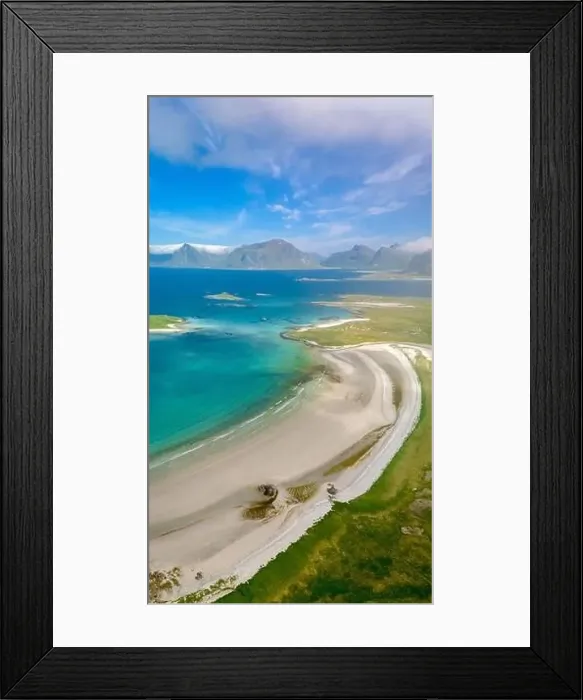 Framed Print : An aerial view of a pristine white sand beach curving along a green coastline
