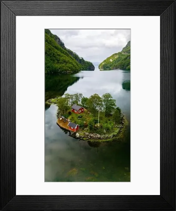 Framed Print : A red cabin nestled on a small island in a fjord surrounded by green mountains and calm water. Lovrafjorden, Norway Framed Print : A red cabin nestled on a small island in a fjord surrounded by green mountains and calm water. Lovrafjorden, Norway