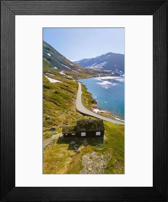 Framed Print : A scenic road winds through a mountainous landscape Framed Print : A scenic road winds through a mountainous landscape