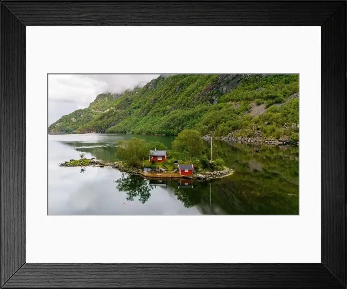 Framed Print : Two red cabins sit on a small island in a Norwegian fjord Framed Print : Two red cabins sit on a small island in a Norwegian fjord