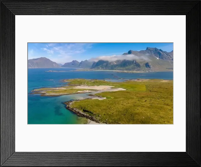 Framed Print : An aerial view of a small, green island with a sandy beach Framed Print : An aerial view of a small, green island with a sandy beach