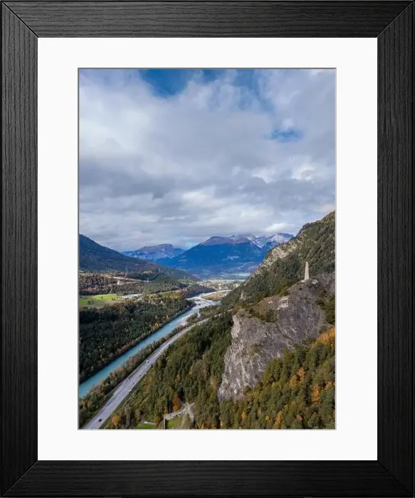 Framed Print : A view of the Rhine River in the Domleschg Valley and the Hochjuvalt fortress in autumn Framed Print : A view of the Rhine River in the Domleschg Valley and the Hochjuvalt fortress in autumn