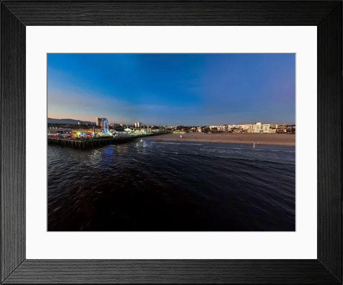 Framed Print : The Santa Monica Beach Pier in California, with Pacific Park at Sunset from a UAV Drone View showing the City Lights Framed Print : The Santa Monica Beach Pier in California, with Pacific Park at Sunset from a UAV Drone View showing the City Lights