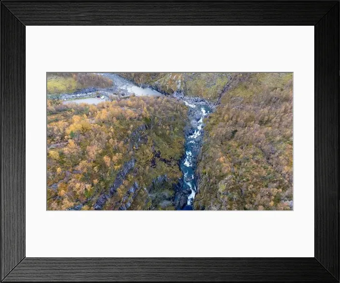 Framed Print : Aerial view of a river flowing through a rugged canyon surrounded by autumn foliage Framed Print : Aerial view of a river flowing through a rugged canyon surrounded by autumn foliage