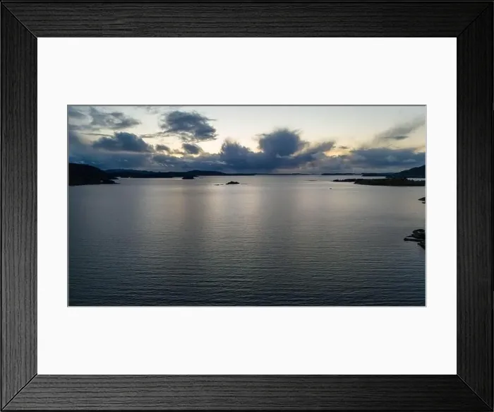 Framed Print : A serene fjord at dusk with a cloudy sky reflecting on the water Framed Print : A serene fjord at dusk with a cloudy sky reflecting on the water