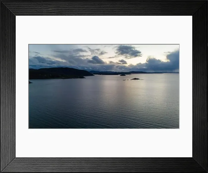 Framed Print : A serene fjord at dusk with scattered clouds and distant hills Framed Print : A serene fjord at dusk with scattered clouds and distant hills