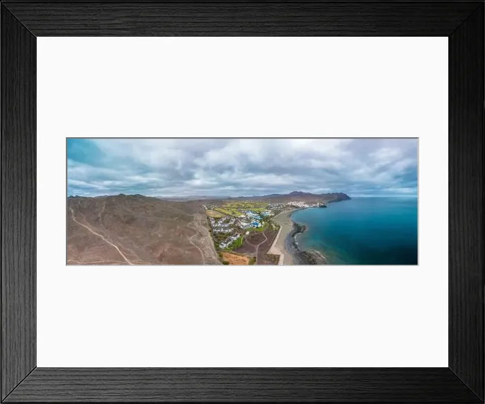 Framed Print : Aerial drone view of Las Playitas fishing town and the beach, Fuerteventura, Canary Islands, Spain Framed Print : Aerial drone view of Las Playitas fishing town and the beach, Fuerteventura, Canary Islands, Spain