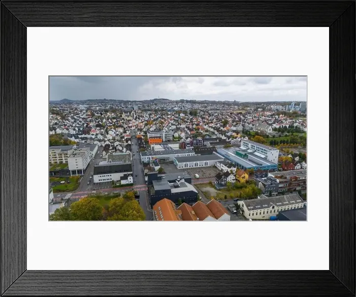 Framed Print : Aerial view of a city with residential houses and industrial buildings Framed Print : Aerial view of a city with residential houses and industrial buildings