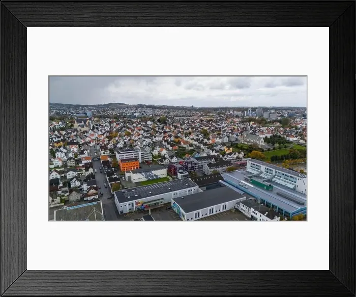 Framed Print : Aerial view of a European city with a mix of residential and commercial buildings Framed Print : Aerial view of a European city with a mix of residential and commercial buildings