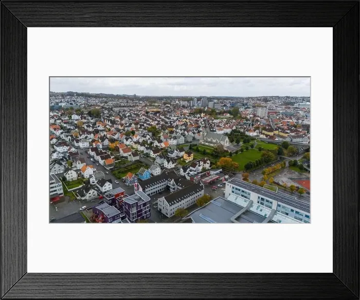 Framed Print : Aerial view of a European city with a mix of residential and commercial buildings Framed Print : Aerial view of a European city with a mix of residential and commercial buildings
