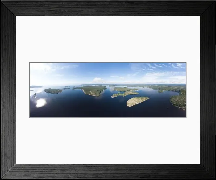 Framed Print : Aerial top view to island Kilpola overgrown with sparse trees in summer sunny day