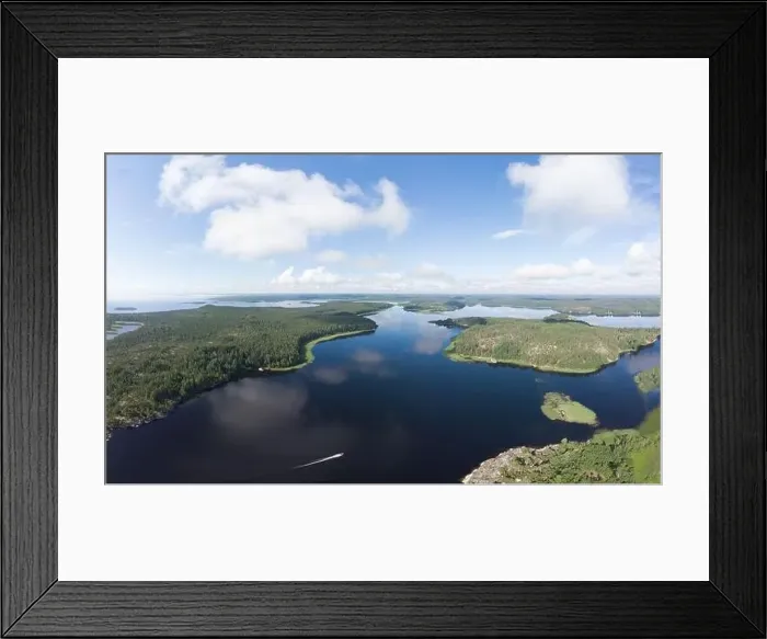 Framed Print : Aerial top view to island Kilpola overgrown with sparse trees in summer sunny day Framed Print : Aerial top view to island Kilpola overgrown with sparse trees in summer sunny day