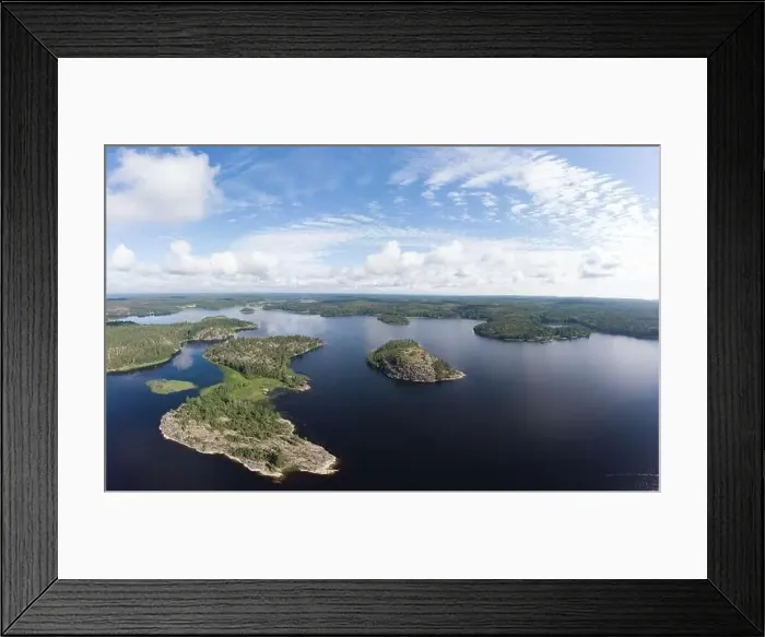 Framed Print : Aerial top view to island Kilpola overgrown with sparse trees in summer sunny day