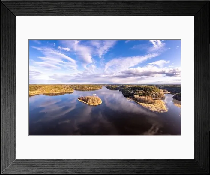 Framed Print : Aerial top view to island overgrown with sparse trees in summer sunny day