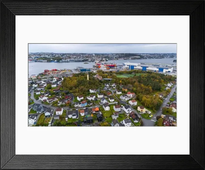 Framed Print : Aerial view of a coastal town with residential houses Framed Print : Aerial view of a coastal town with residential houses