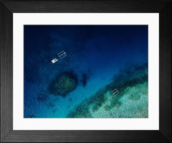 Framed Print : Seascape aerial view over blue ocean with coral reef and boats in Bali Framed Print : Seascape aerial view over blue ocean with coral reef and boats in Bali