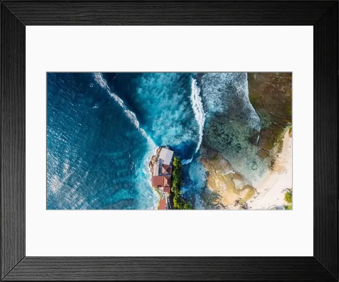 Framed Print : Scenic landscape with rocks on coastline and blue ocean with waves in Lembongan island, Bali. Aerial view Framed Print : Scenic landscape with rocks on coastline and blue ocean with waves in Lembongan island, Bali. Aerial view