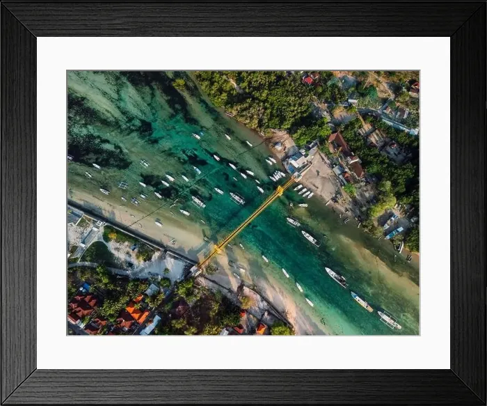Framed Print : Aerial view of a bridge connecting two tropical islands over a narrow ocean channel Framed Print : Aerial view of a bridge connecting two tropical islands over a narrow ocean channel