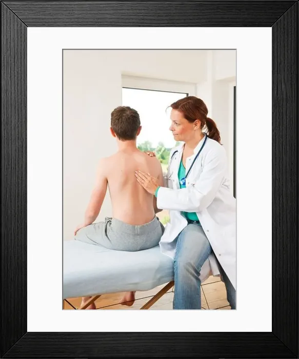 Framed Print : Male teenage boy at female doctor Framed Print : Male teenage boy at female doctor