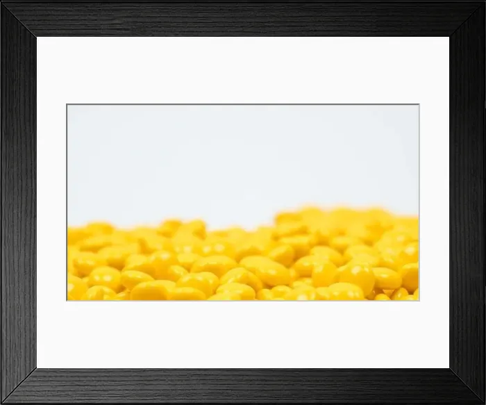 Framed Print : Yellow sugar coated tablets pills on white background with copy space. Medicine for treatment constipation Framed Print : Yellow sugar coated tablets pills on white background with copy space. Medicine for treatment constipation