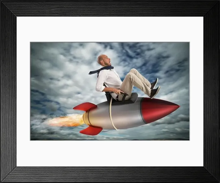 Framed Print : Businessman flying over a rocket in the sky. Increase the climb to success concept Framed Print : Businessman flying over a rocket in the sky. Increase the climb to success concept