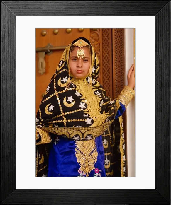 Framed Print : Young girl in traditional dress, Bahrain, Middle East Framed Print : Young girl in traditional dress, Bahrain, Middle East