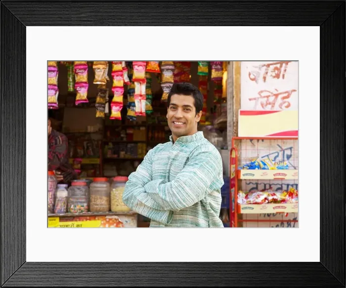 Framed Print : Portrait of a shopkeeper smiling Framed Print : Portrait of a shopkeeper smiling