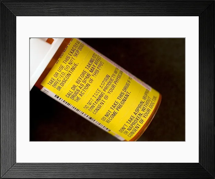 Framed Print : Warning labels on prescription medicine bottle Framed Print : Warning labels on prescription medicine bottle