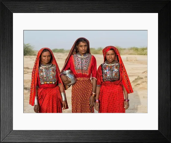 Framed Print : Three Fakirani women in traditional colorful clothes with a water jug, Great Rann of Kutch, Gujarat, India Framed Print : Three Fakirani women in traditional colorful clothes with a water jug, Great Rann of Kutch, Gujarat, India