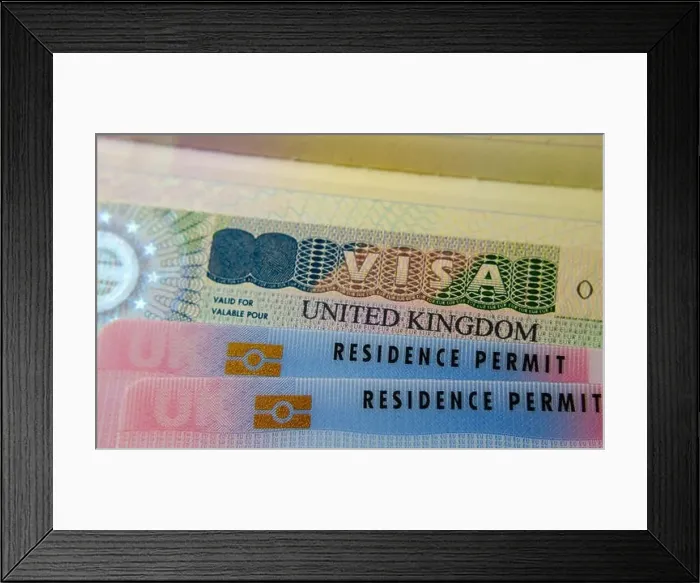 Framed Print : UK BRP cards for Tier 2 work visa placed on top of UK Business VISA sticker in the passport. Close up photo Framed Print : UK BRP cards for Tier 2 work visa placed on top of UK Business VISA sticker in the passport. Close up photo