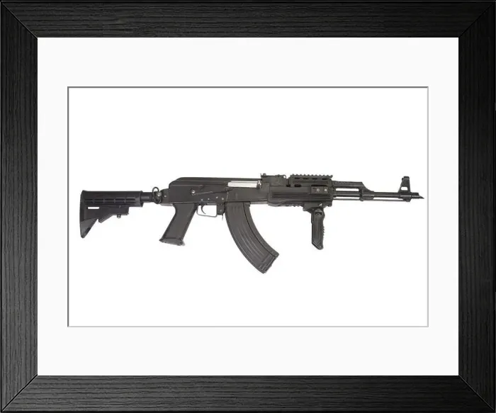Framed Print : Rare first model AK - 47 assault rifle with modern tactical accessories isolated on white Framed Print : Rare first model AK - 47 assault rifle with modern tactical accessories isolated on white