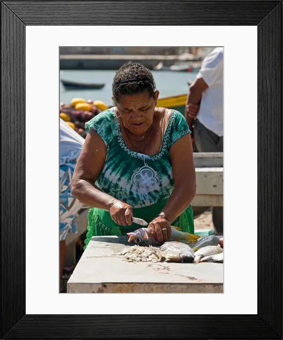 Framed Print : Vertical portrait of a local Cape Verdean woman gutting fresh fish on the quay in Palmeira on Cape Verde Framed Print : Vertical portrait of a local Cape Verdean woman gutting fresh fish on the quay in Palmeira on Cape Verde