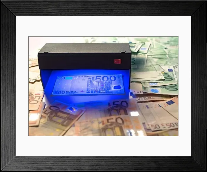 Framed Print : Money fake testing - euro banknotes authentication check in UV Currency Detector lights Framed Print : Money fake testing - euro banknotes authentication check in UV Currency Detector lights