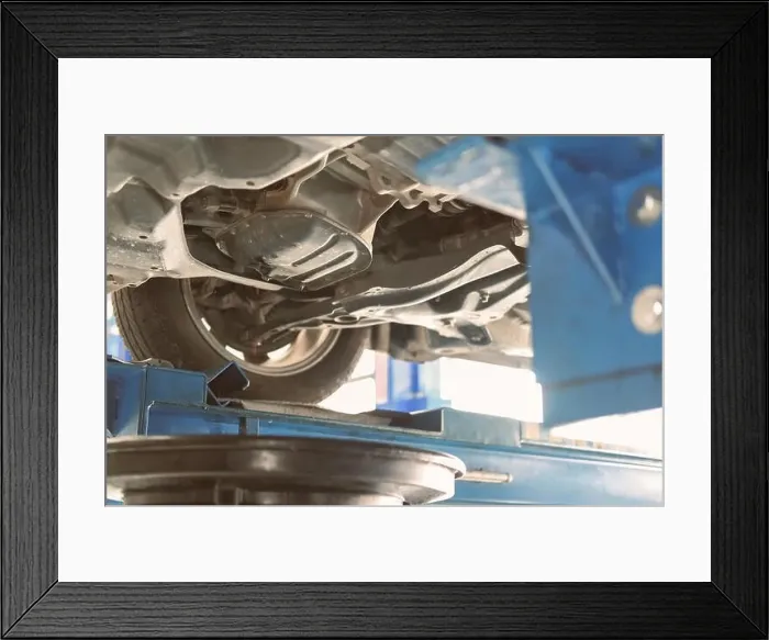 Framed Print : vehicle lift up by hydraulic for motor oil change and transmission inspection Framed Print : vehicle lift up by hydraulic for motor oil change and transmission inspection