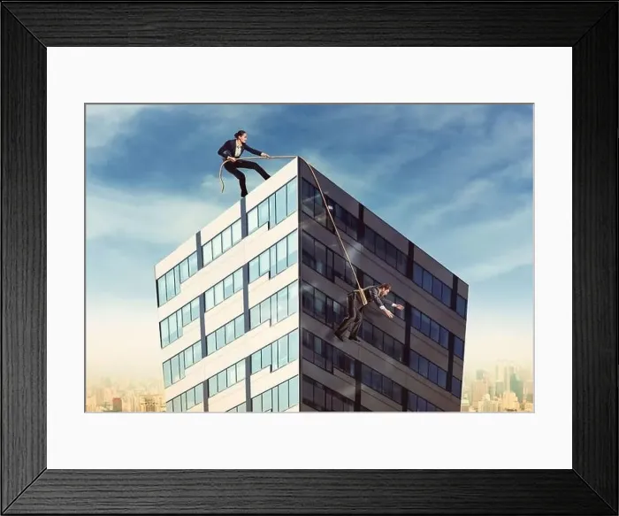 Framed Print : Businesswoman pulling businesswoman on the roof with a rope Framed Print : Businesswoman pulling businesswoman on the roof with a rope
