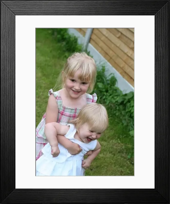 Framed Print : Two little blonde girls, children kids laughing and playing in the garden