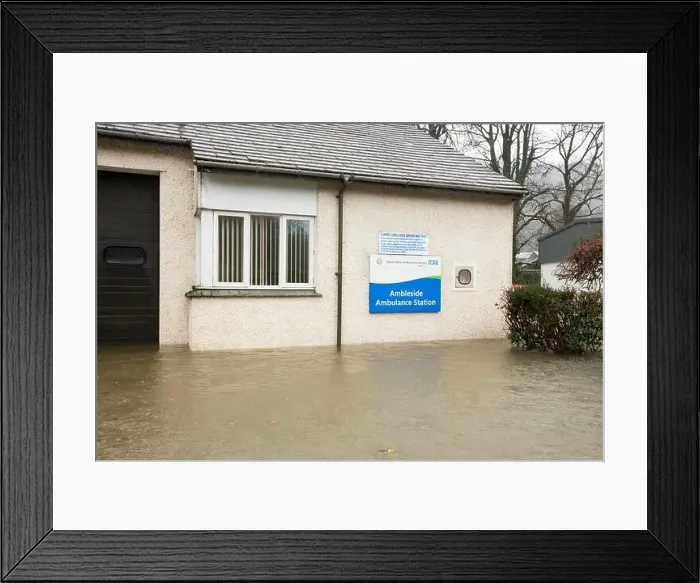 Framed Print : Ambleside Ambulance Station surrounded by flood waters by the banks of the River Rothay in Ambleside Framed Print : Ambleside Ambulance Station surrounded by flood waters by the banks of the River Rothay in Ambleside