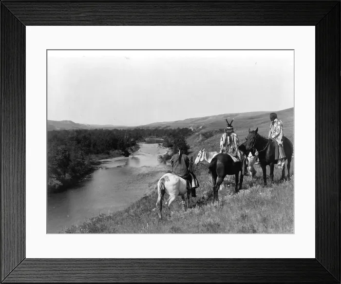 Framed Print : Three Piegan Indians and four horses on hill above river, 1910. Photograph by Edward Curtis (1868-1952) Framed Print : Three Piegan Indians and four horses on hill above river, 1910. Photograph by Edward Curtis (1868-1952)