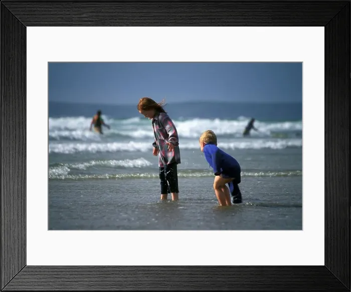 Framed Print : Children playing in sea fully clothed Broad Haven Pembrokeshire Coast National Park West Wales UK Framed Print : Children playing in sea fully clothed Broad Haven Pembrokeshire Coast National Park West Wales UK