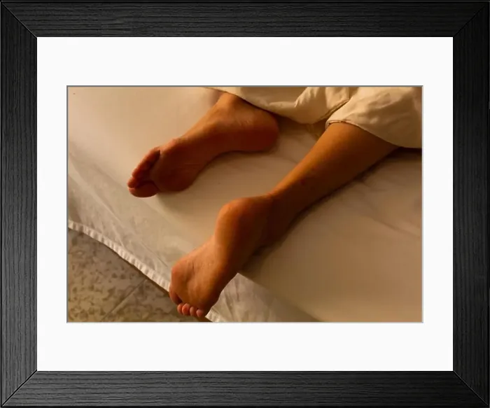 Framed Print : Hispanic woman resting in hotel bed Framed Print : Hispanic woman resting in hotel bed