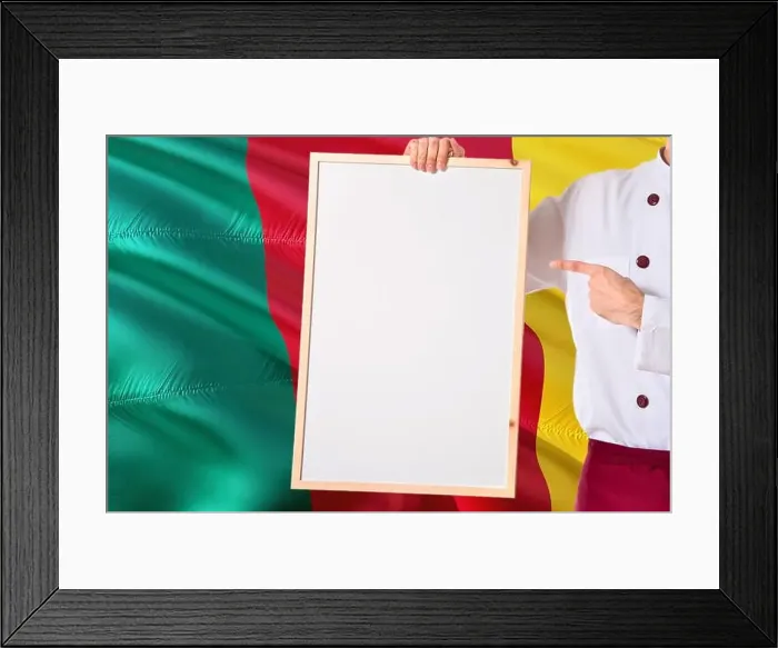 Framed Print : Cameroonian Chef holding blank whiteboard menu on Cameroon flag background Framed Print : Cameroonian Chef holding blank whiteboard menu on Cameroon flag background