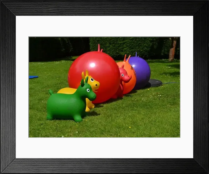 Framed Print : Colorful space hoppers in a line Framed Print : Colorful space hoppers in a line