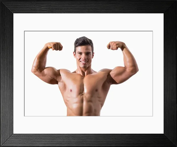 Framed Print : Portrait of a muscular young man flexing muscles Framed Print : Portrait of a muscular young man flexing muscles