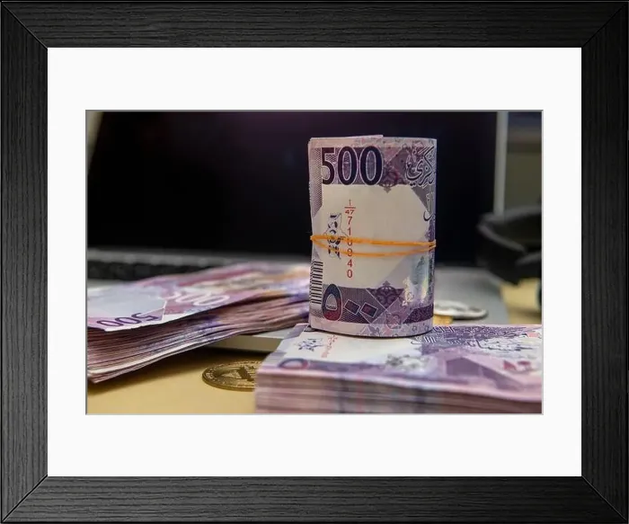 Framed Print : Qatar Currency Newley Launched Bank Notes. Qatari Riyal, Notes, 500 on laptop Background. Business and Finance Concept Framed Print : Qatar Currency Newley Launched Bank Notes. Qatari Riyal, Notes, 500 on laptop Background. Business and Finance Concept