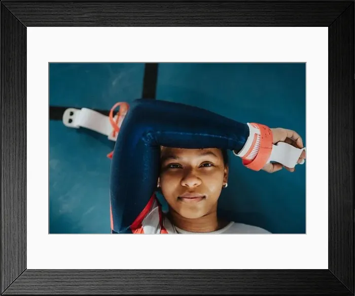 Framed Print : Directly above portrait of female athlete resting on floor Framed Print : Directly above portrait of female athlete resting on floor