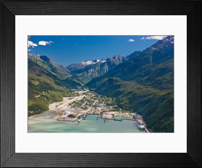 Framed Print : Aerial view of the city of Skagway with a cruise ship docked at port, Southeast Alaska, Summer Framed Print : Aerial view of the city of Skagway with a cruise ship docked at port, Southeast Alaska, Summer