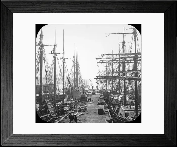 Framed Print : Late Victorian view of the docks in New York City. many sailing ships can be seen loading or unloading their goods Framed Print : Late Victorian view of the docks in New York City. many sailing ships can be seen loading or unloading their goods