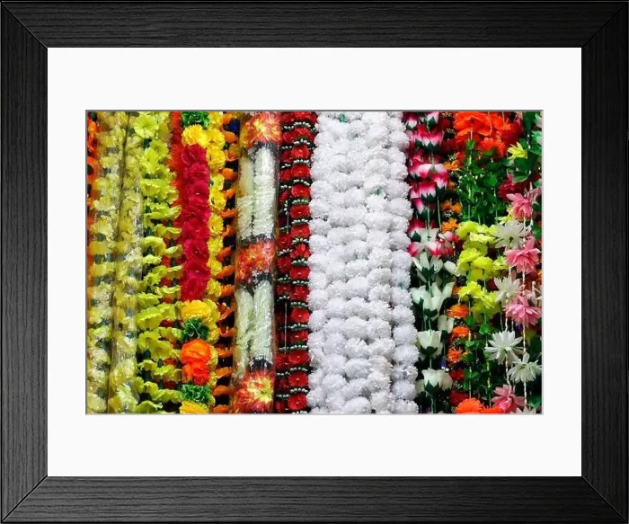 Framed Print : Indian flower decoration made of plastic flowers and in all kind of colors Framed Print : Indian flower decoration made of plastic flowers and in all kind of colors